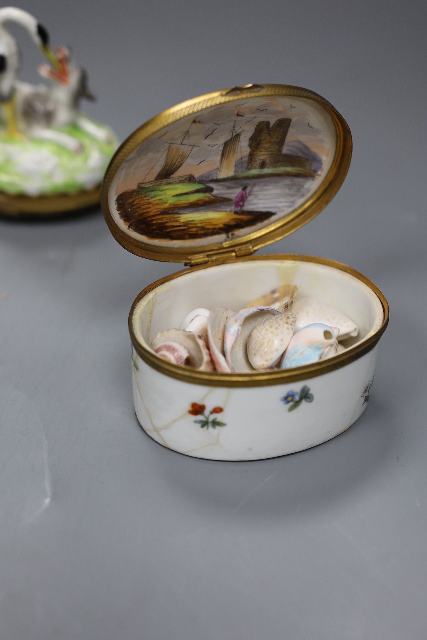Two Continental porcelain snuff boxes circa 1900, one a novelty Aesop fable design, height 9cms